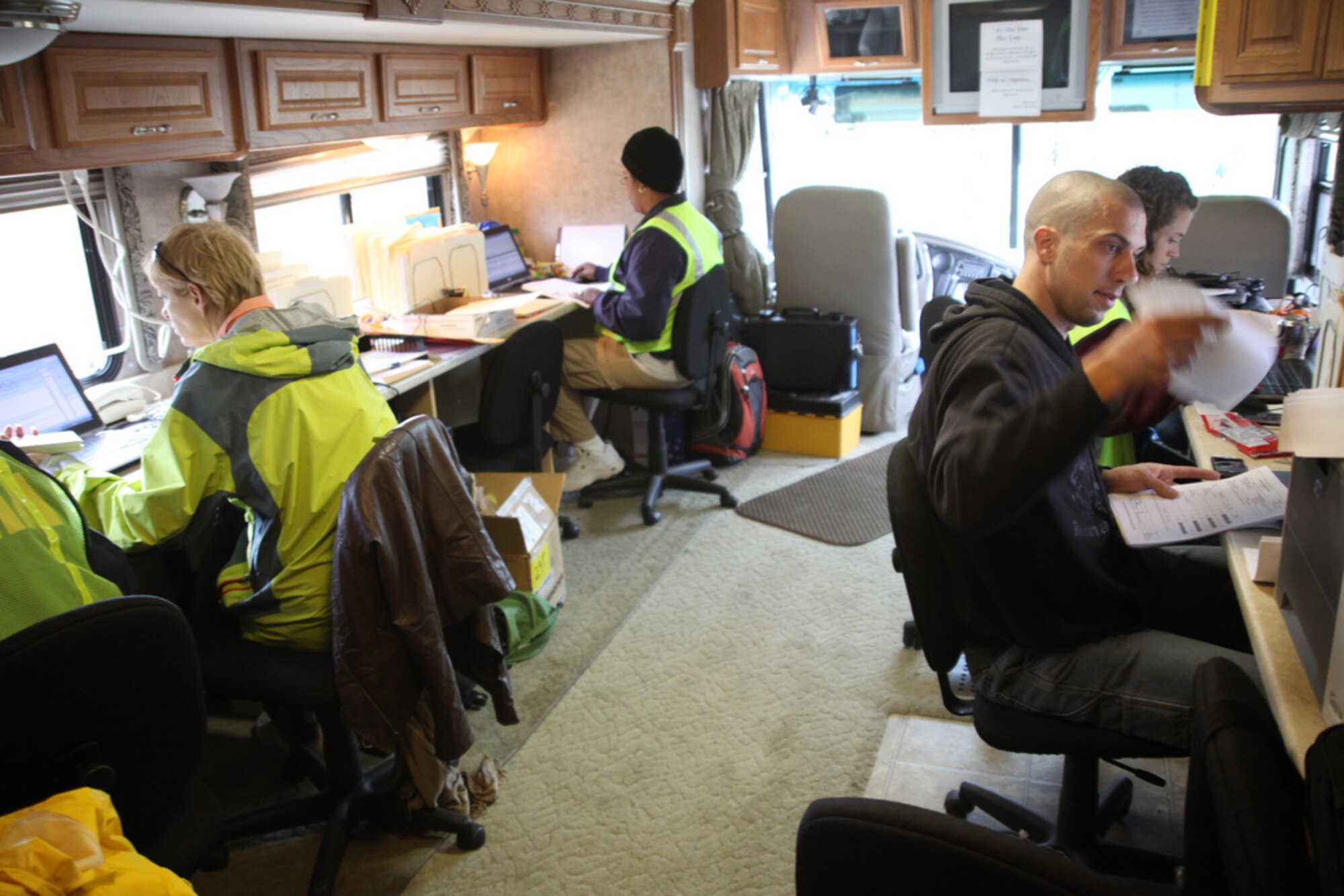 Federal Emergency Management Agency employees work in the mobile communications operations center at the Lakehurst staging area on Joint Base McGuire-Dix-Lakehurst, N.J., Oct. 30. FEMA is working to get needed supplies to areas throughout New York and New Jersey affected by Hurricane Sandy. (U.S. Air Force photo by 2nd Lt. David J. Murphy/Released)