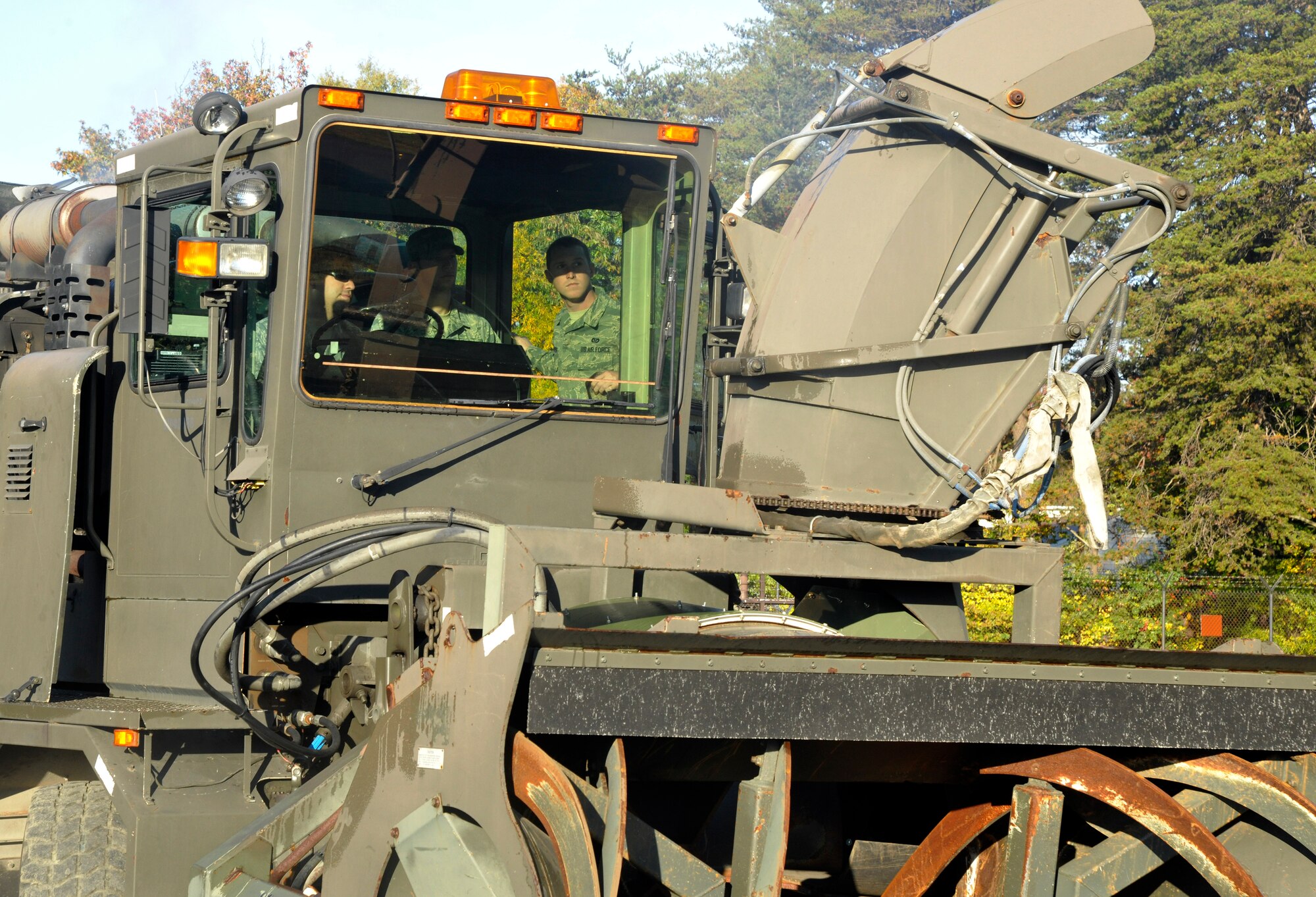 11th Civil Engineer Squadron Airmen man the controls of a flight line snow blower during unit snow-removal training on the Andrews flight line Oct. 18, 2012. The Airmen are part of Andrews’ snow-removal team which specializes in clearing the base’s airfield and roadways in lieu of hazardous winter weather. (U.S. Air Force photo/Senior Airman Lindsey Porter) 