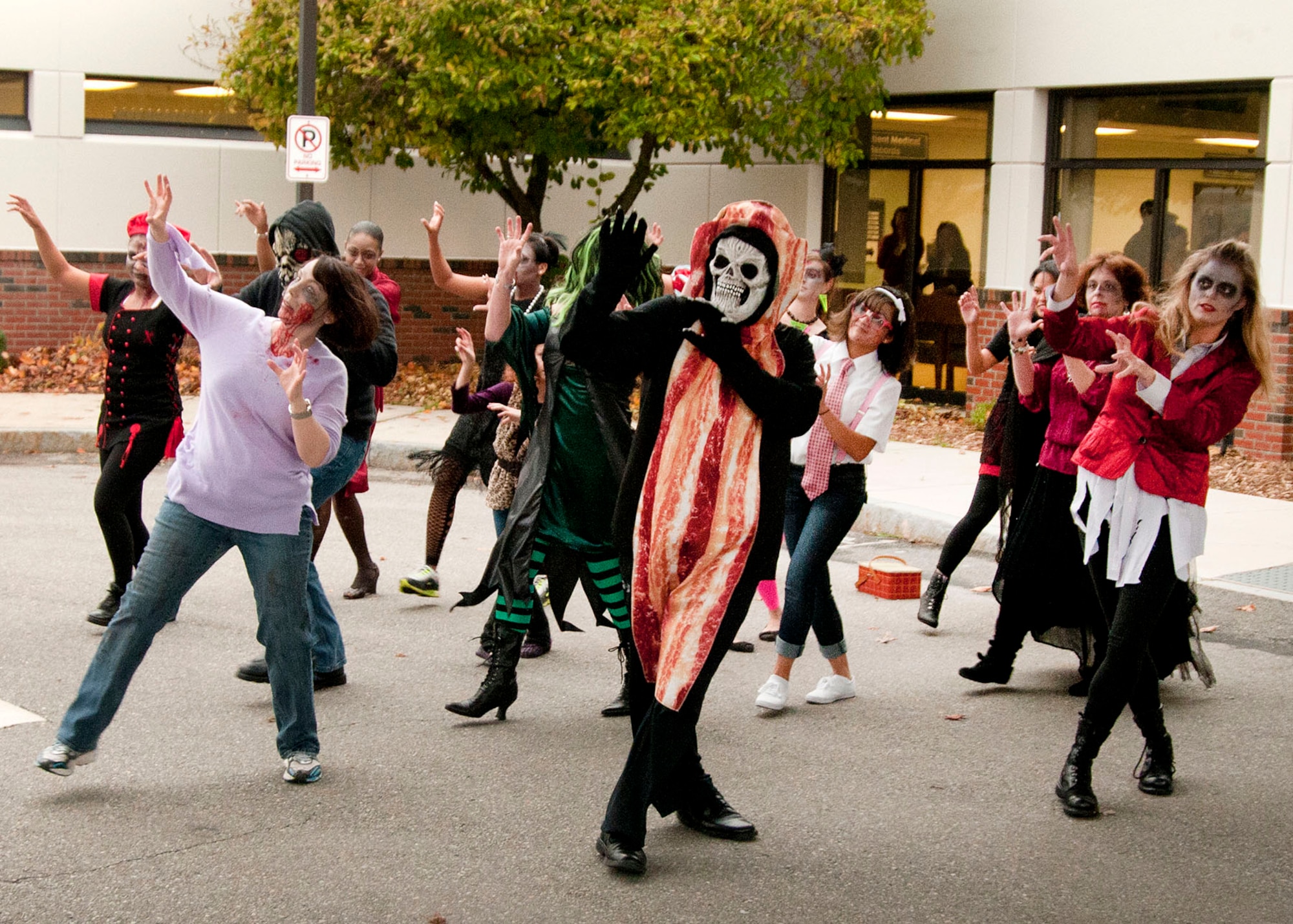 HANSCOM AIR FORCE BASE, Mass. -- Several members of the 66th Medical Squadron reenacted the 1980s Michael Jackson music video, "Thriller," outside the clinic Oct. 31 in the spirit of Halloween. Squadron personnel dressed up as zombies and performed the dance routine as a crowd of onlookers watched. (U.S. Air Force photo by Mark Wyatt)