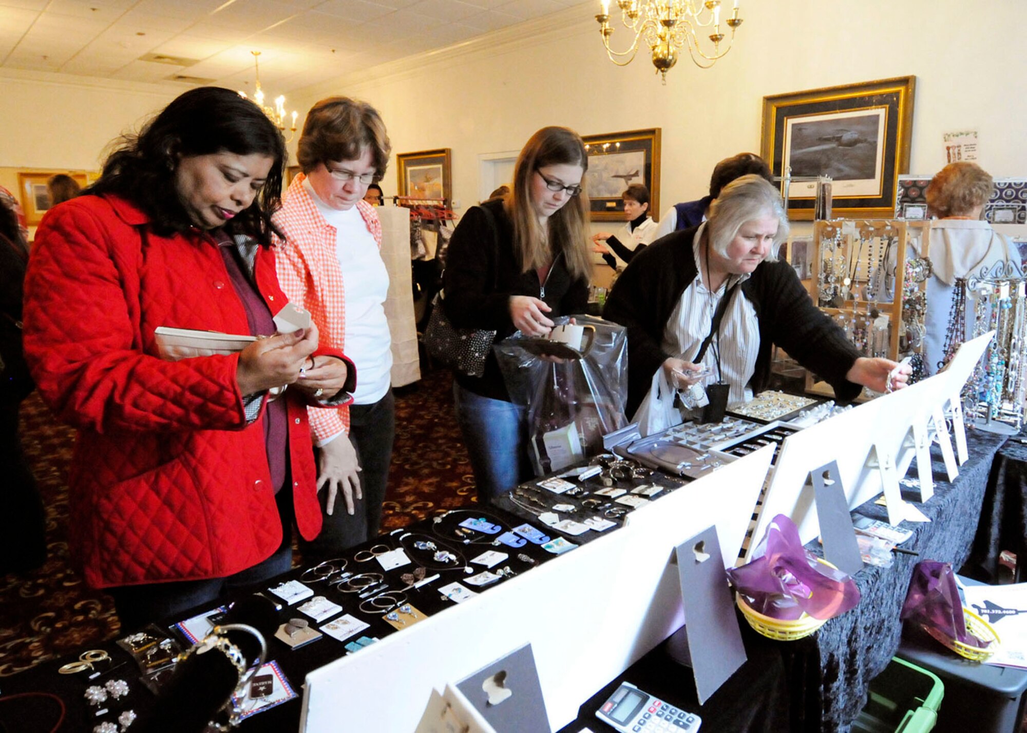 HANSCOM AIR FORCE BASE, Mass. -- Shoppers browse through jewelry at the Hanscom Spouses Club holiday bazaar and craft fair at the Minuteman Commons, Oct. 26. Many on-base and local crafters, as well as home-based businesses, were on hand to provide the community an opportunity to begin their holiday shopping early. (U.S. Air Force photo by Linda LaBonte Britt)