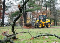 HANSCOM AIR FORCE BASE, Mass. -- Hanscom civil engineers cleanup debris off roads and in parking lots Oct. 30 in the aftermath of Hurricane Sandy that passed through Massachusetts a day earlier. Personnel from the Emergency Operations Center, housing, security forces, fire department, civil engineering and more were stationed on base around the clock to respond to any storm damage, including flooding, downed trees or power outages. (U.S. Air Force photo by Mark Wyatt)