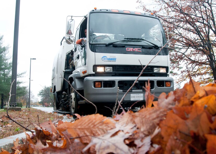 HANSCOM AIR FORCE BASE, Mass. -- Hanscom civil engineers cleanup debris off roads and in parking lots Oct. 30 in the aftermath of Hurricane Sandy that passed through Massachusetts a day earlier. Personnel from the Emergency Operations Center, housing, security forces, fire department, civil engineering and more were stationed on base around the clock to respond to any storm damage, including flooding, downed trees or power outages. (U.S. Air Force photo by Mark Wyatt)