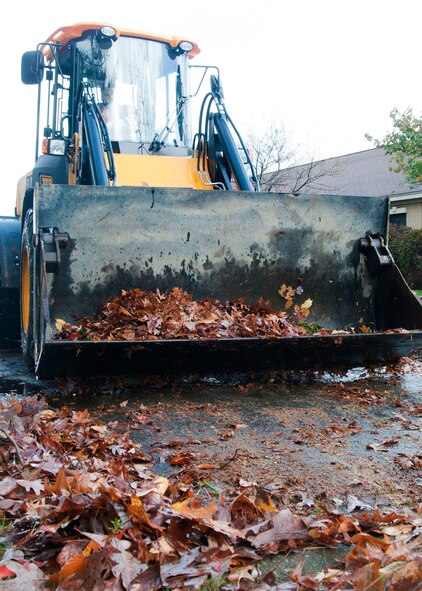 HANSCOM AIR FORCE BASE, Mass. -- Hanscom civil engineers clean up debris off roads and in parking lots Oct. 30 in the aftermath of Hurricane Sandy that passed through Massachusetts a day earlier. Personnel from the Emergency Operations Center, housing, security forces, fire department, civil engineering and more were stationed on base around the clock to respond to any storm damage, including flooding, downed trees or power outages. (U.S. Air Force photo by Mark Wyatt)
