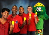 Valentia Coleman, Harold Cherry, Nigel Wallace and Jeremy Egg, 902nd Engineer Squadron members and mascot volunteers, pose with Sunny GreenWatts, the Joint Base San Antonio energy team’s symbol of energy conservation, Oct. 16. (U.S. Air Force photo by Josh Rodriguez)