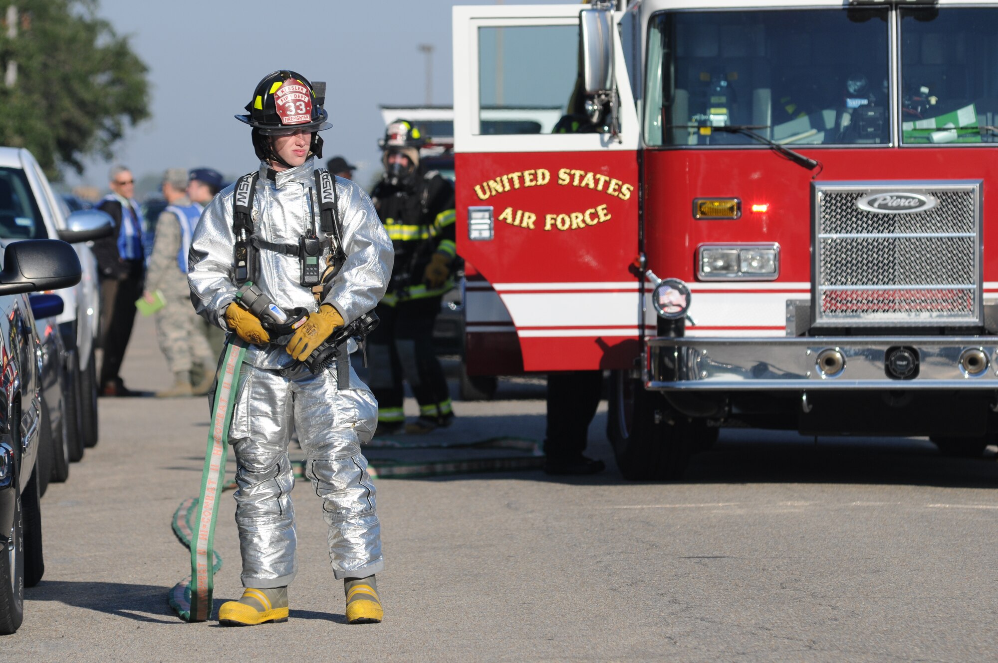 Airman 1st Class Seth Corn , Keesler firefighter, deploys pumper hand line to aid mitigation and responders during a hazardous material and major accident response exercise Oct. 31, 2012, at Hangar 4, Keesler Air Force Base, Miss.  The exercise scenario consisted of a group of Airmen cleaning inside the hangar in preparation for demolition when a shelf holding old munitions fell to the ground causing one to break open, explode and splash an “oily substance” on several of the “victims.”  The exercise helped prepare first responders in the event of a real-world incident.  (U.S. Air Force photo by Kemberly Groue)