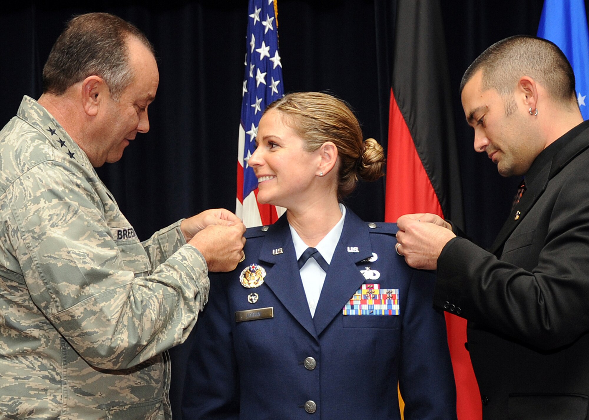 SPANGDAHLEM AIR BASE, Germany – U.S. Air Force Gen. Philip M. Breedlove, U.S. Air Forces in Europe commander and native of Austin, Texas, pins lieutenant colonel rank onto U.S. Air Force Maj. Cat Logan, 52nd Force Support Squadron commander and native of Henderson N.C., during her ceremonial pin-on at Club Eifel Oct. 31, 2012. Logan previously worked with Breedlove in the Pentagon and now uses his positive attitude as an outline of how she leads her squadron today. (U.S. Air Force photo by Staff Sgt. Daryl Knee/Released)