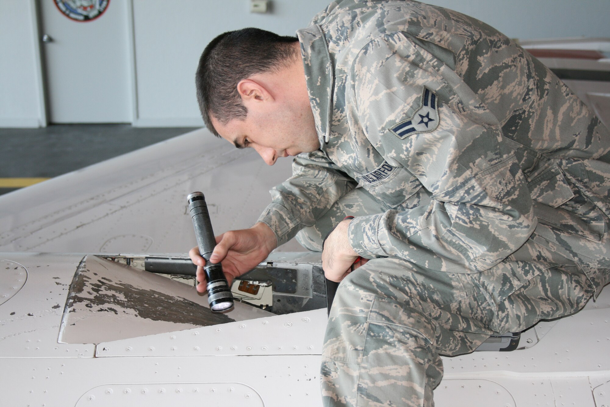 Airman 1st Class Zachary ZeZeus, a member of the National Guard's 113th Wing at Joint Base Andrews, Md., conducts an aircraft inspection during F-16 Mission Ready Airman training at Sheppard Air Force Base, Texas, Nov. 1, 2012.  ZeZeus graduated the course Nov. 7 as an ACE award winner after finishing with a 100 percent academic average. (U.S. Air Force courtesy photo)