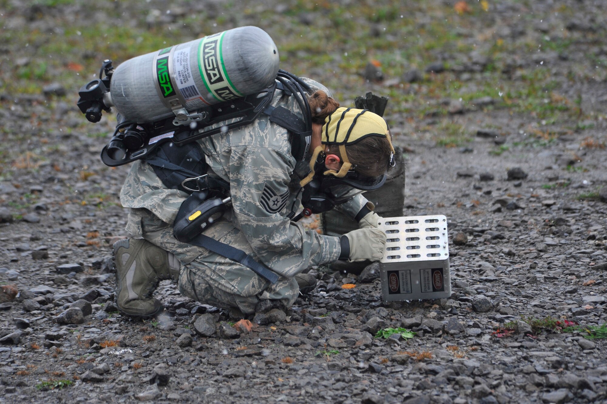 An explosive ordinance technician examines a chaff pod during a major accident response exercise, Rhine Ordnance Barracks, Oct. 27. The exercise tested various units’ ability to respond to a major accident and their aptitude to work together to handle assorted challenges that may arise during a crisis response. (U.S. Air Force photo/Airman 1st Class Trevor Rhynes)
