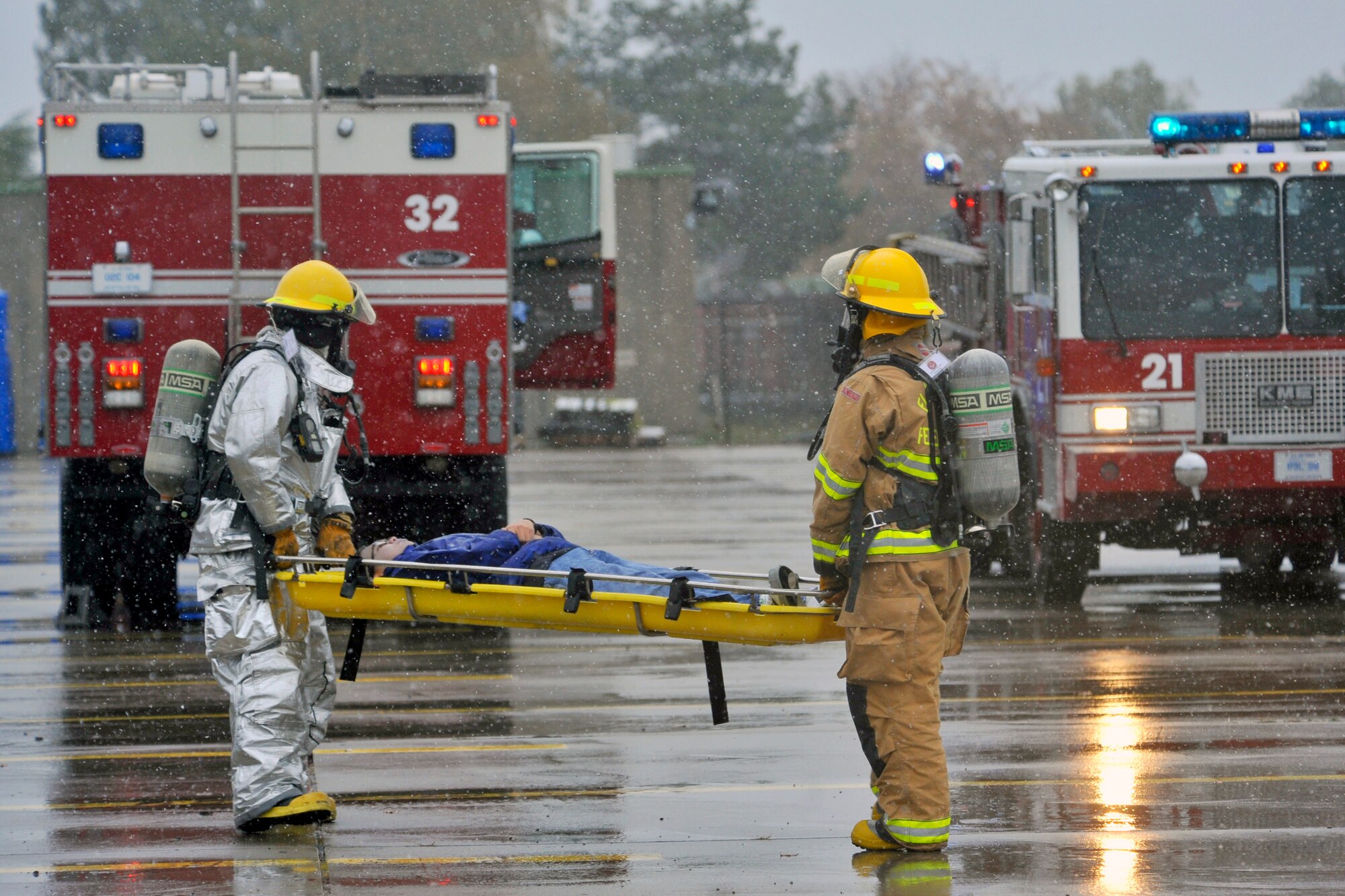 Firefighters with the 886th Civil Engineer Squadron transport a ‘victim’ during a major accident response exercise, Rhine Ordnance Barracks, Oct. 27. The exercise tested various units’ ability to respond to a major accident and their aptitude to work together to handle assorted challenges that may arise during a crisis response. (U.S. Air Force photo/Airman 1st Class Trevor Rhynes)