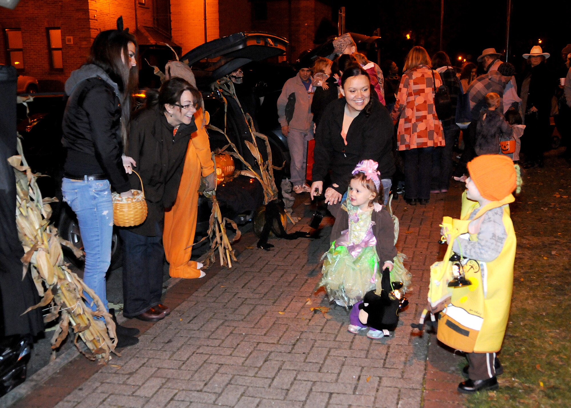 Hundreds of Team Mildenhall members and their families attended the Trunk-or-Treat Spooktacular Oct. 31, 2012, at RAF Mildenhall, England.  At the event, decorative, candy-filled vehicles lined the sidewalk in front of the Galaxy Club giving children a safe place to collect candy on Halloween.  (U.S. Air Force photo by Staff Sgt. Tabitha M. Lee/Released)

