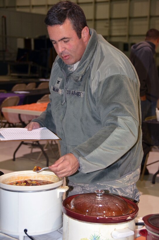 WRIGHT-PATTERSON AIR FORCE BASE, Ohio - Col. Michael Major, 445th Airlift Wing vice commander, samples one of 22 pots of chili as he and three other judges decide the winner of this year’s 445th Airlift Wing Chili Cook-off that raised $380 for the Combined Federal Campaign. (U.S. Air Force photo/Stacy Vaughn)