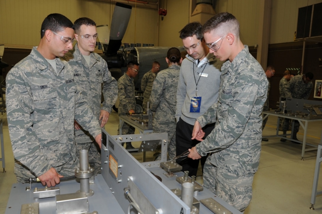 Airmen-in-Training at the 361st Training Squadron's propulsion
apprentice course demonstrate wiring repair techniques to a civic leader
Oct. 31, 2012 at Sheppard Air Force Base, Texas.  The civic leaders received
a tour of the base, getting first-hand looks at both the 82nd Training Wing
and 80th Flying Training Wing missions. (U.S. Air Force photo/Felton Joshua)

