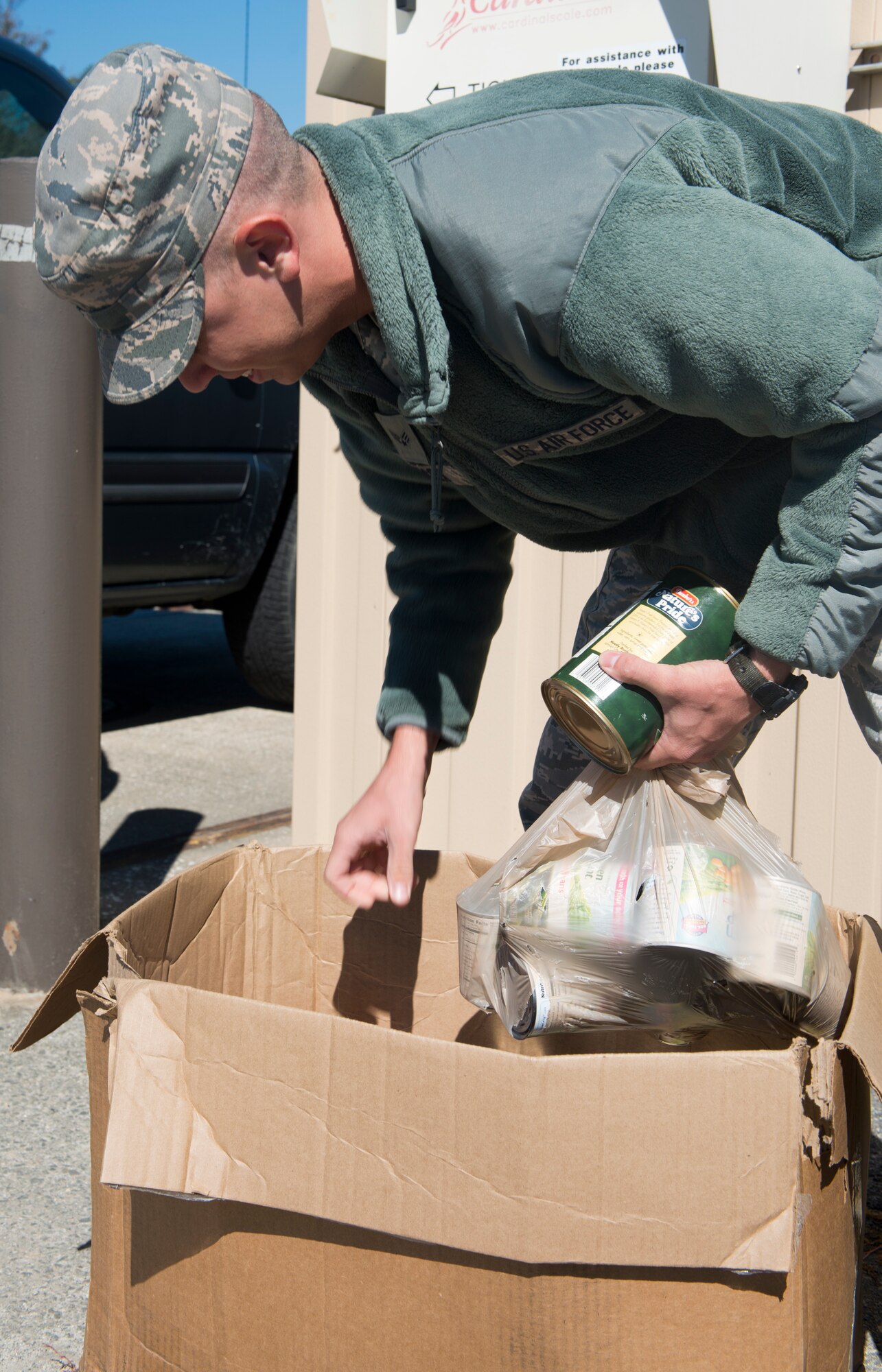 U.S. Air Force Senior Airman Brad Adcox, 822nd Base Defense Squadron, grabs cans of food at Moody Air Force Base, Ga., Oct. 30, 2012. Moody donated the food to Second Harvest Food Bank of Valdosta. (U.S. Air Force photo by Senior Airman Douglas Ellis/Released)
