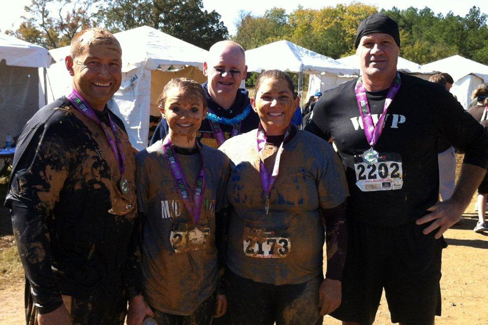 Mark Geer, Chole Lewis, Douglas McClain, Andrea Amburn and Darryl Moore pose for a photo after completing the “Mud Fears Me” obstacle race in Shreveport, La., Oct. 27, 2012. The event is a fun 3.1 mile / 20 + obstacle course race designed to test all around strength, stamina, mental grit, and camaraderie. Participants were forced to overcome numerous obstacles such as the Ladder to Success, Mud Dunk, Silverback Swing, Walk of Shame, Torment Trenches, Over/Under Dare, Pit of Pain, the Belly Bog and the Cargo Climb, just to name a few. The event was held to raise money for “Child Help” that benefits abused children and other local charities. (Courtesy photo/Released)