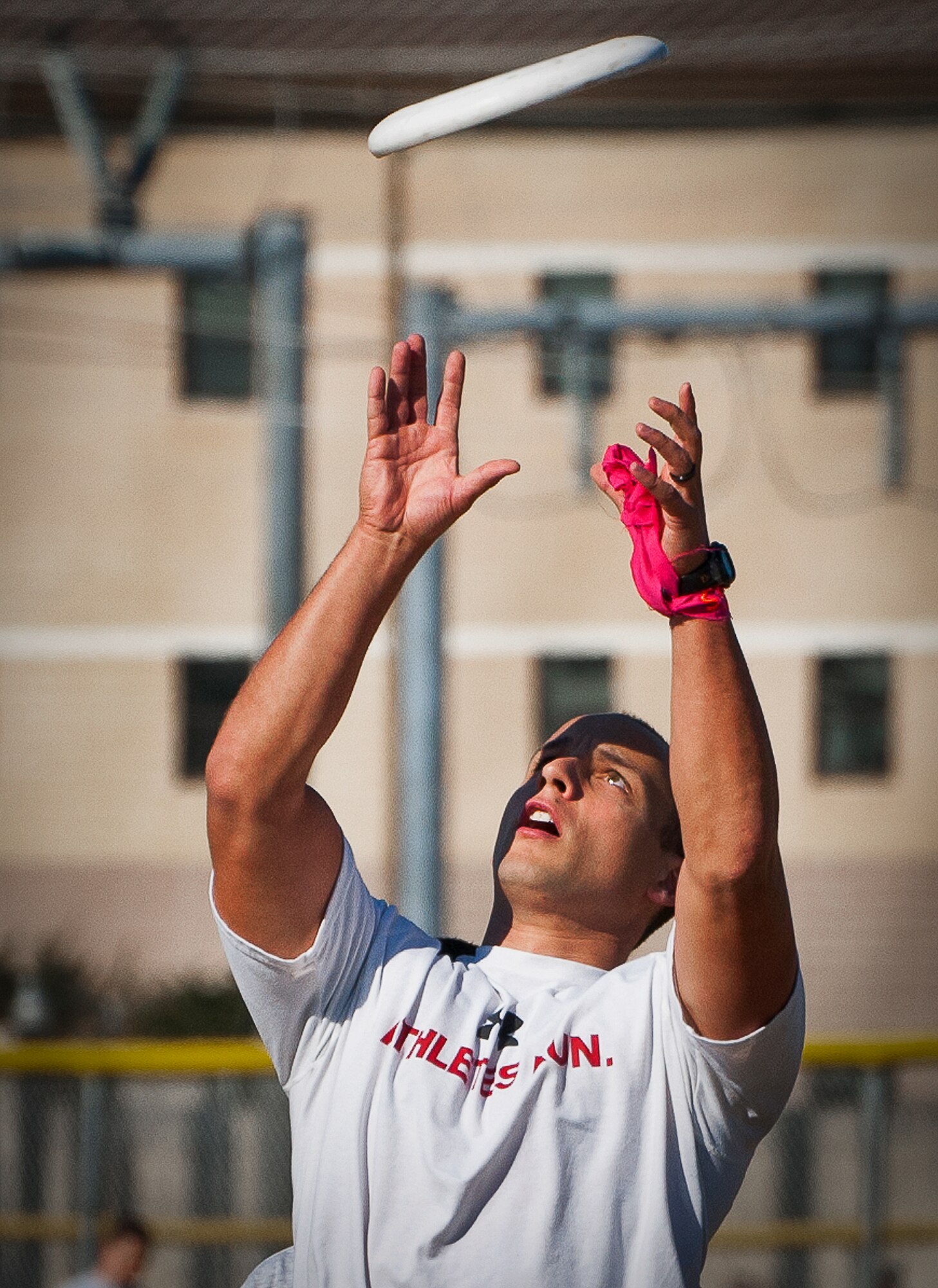 An Airman leaps up for a catch at the ultimate Frisbee competition at the 96th Test Wing’s Wingman Day event Oct. 31 at Eglin Air Force Base, Fla.  Hundreds of Airmen and civilians participated in physical and non-physical challenges highlighting teamwork and resiliency.  (U.S. Air Force photo/Samuel King Jr.)