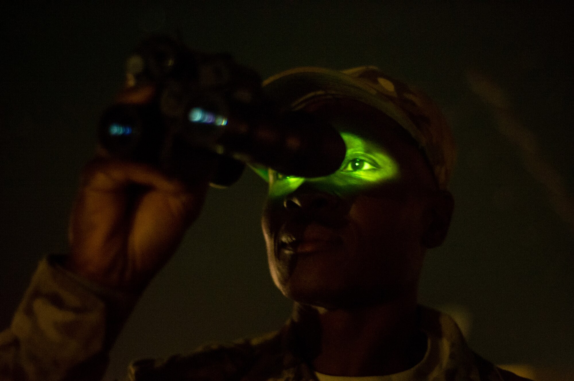 U.S. Air Force Tech. Sgt. Omar Nurse, battlefield weather forecaster, 19th Expeditionary Weather Squadron, uses night vision goggles to conduct a weather observation, making sure visibility and climate matches the main weather sensor data on Oct. 7, 2012, at Forward Operating Base Shank, Afghanistan. The 19th EWS provides Army ground commanders with accurate and real-time weather conditions and offers alternative options to help commanders make informed decisions on combat operations. (U.S. Air Force photo/Staff Sgt. Jonathan Snyder)