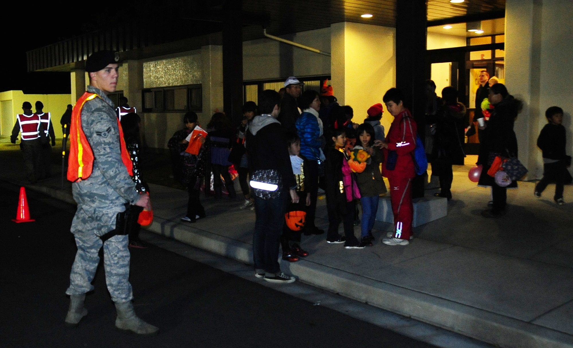 U.S. Air Force Airman 1st Class Craig Fry, 35th Security Forces Squadron basic force protector, patrols the roads during Halloween at Misawa Air Base, Japan, Oct. 31, 2012. Fry, along with other 35 SFS members, patrolled the base to ensure trick-or-treaters had a fun, but safe night.(U.S. Air Force photo by Staff Sgt. April Quintanilla)