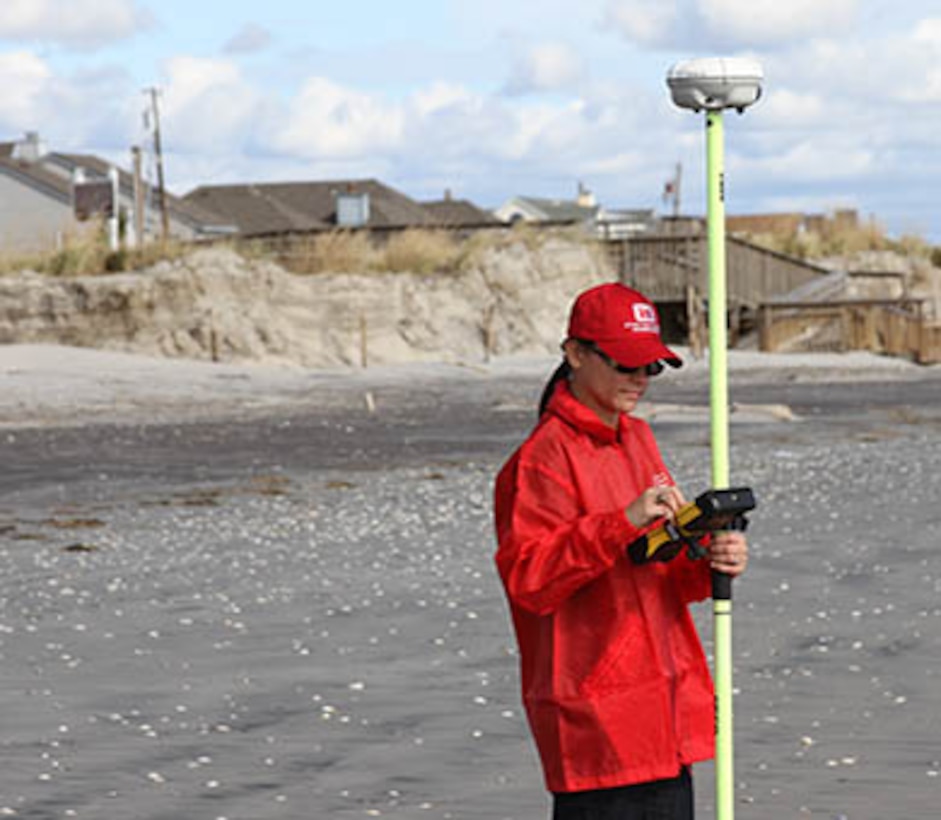 Survey Technician Angelica De-Hoyos Molina uses GPS to survey damages along the New Jersey shore following historic Hurricane Sandy. The U.S. Army Corps of Engineers Philadelphia District has sent teams to inspect the coast lines of New Jersey and Delaware.