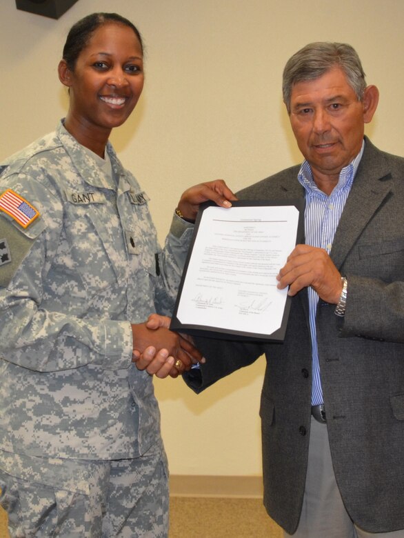 District Commander Lt. Col. Antoinette Gant and ESCAFCA Chairman Sal Reyes sign an agreement to study spoil bank levees along the east side of the Rio Grande near the Town of Bernalillo, N.M.