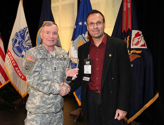 Fiscal year 2012 began with Albuquerque District Deputy for Small Business Programs Daniel Curado’s selection as the Corps’ Small Business Specialist of the Year 2011 (shown with the award and Maj. Gen. Bo Temple) at the national Society of American Military Engineers Small Business Conference Nov. 30, 2011.