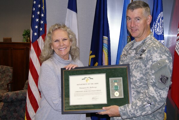 Maggie Hellwege, Equal Employment Office, received a Commanders Award for Civilian Service Nov. 1 to congratulate her on her retirement after 31 years of federal service. 