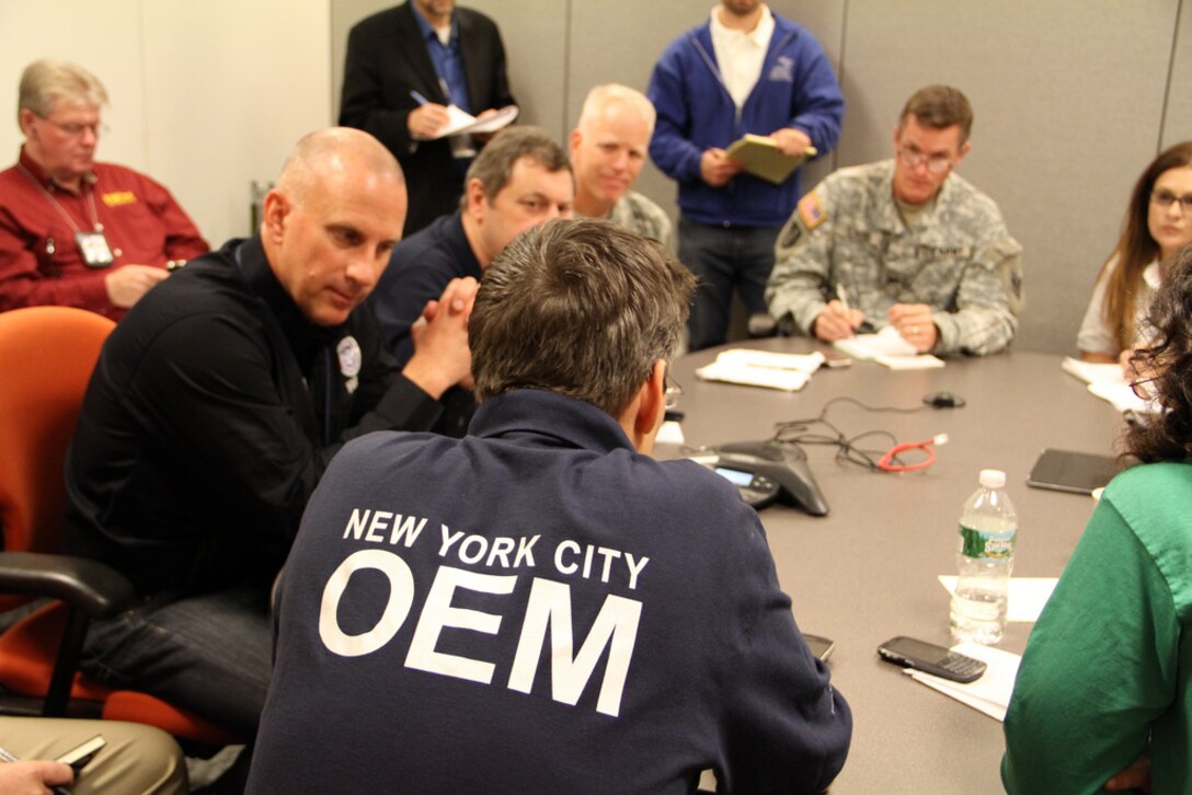 Col. Kent D. Savre, commander of the U.S. Army Corps of Engineers North Atlantic Division, and Col. Paul Owen, commander of the U.S. Army Corps of Engineers New York District, meet with New York City emergency management officials, FEMA, and others during a briefing on the city's dewatering operations Oct. 30, 2012.