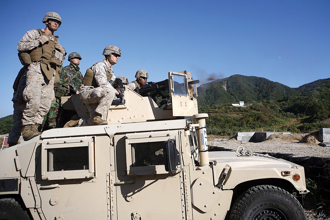 Republic of Korea and U.S. Marines fire the MK19 40 mm grenade launcher Oct. 22 as part of a weeklong combined-arms training exercise during Korean Marine Exchange Program 13-1. 