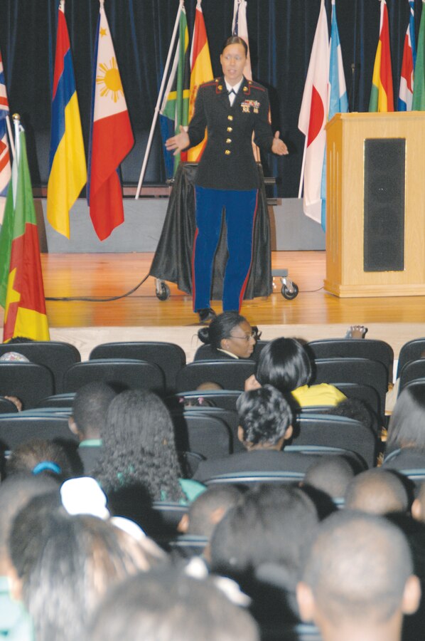 Staff Sgt. Juana DeLosSantos, equal opportunity advisor, Marine Corps Logistics Command, speaks at Albany State University’s kickoff ceremony celebrating International Education Week, Oct. 9.  DeLosSantos encouraged the crowd of students and teachers to be the change they wish to see and to never give up on their dreams of making a difference and succeeding in life.