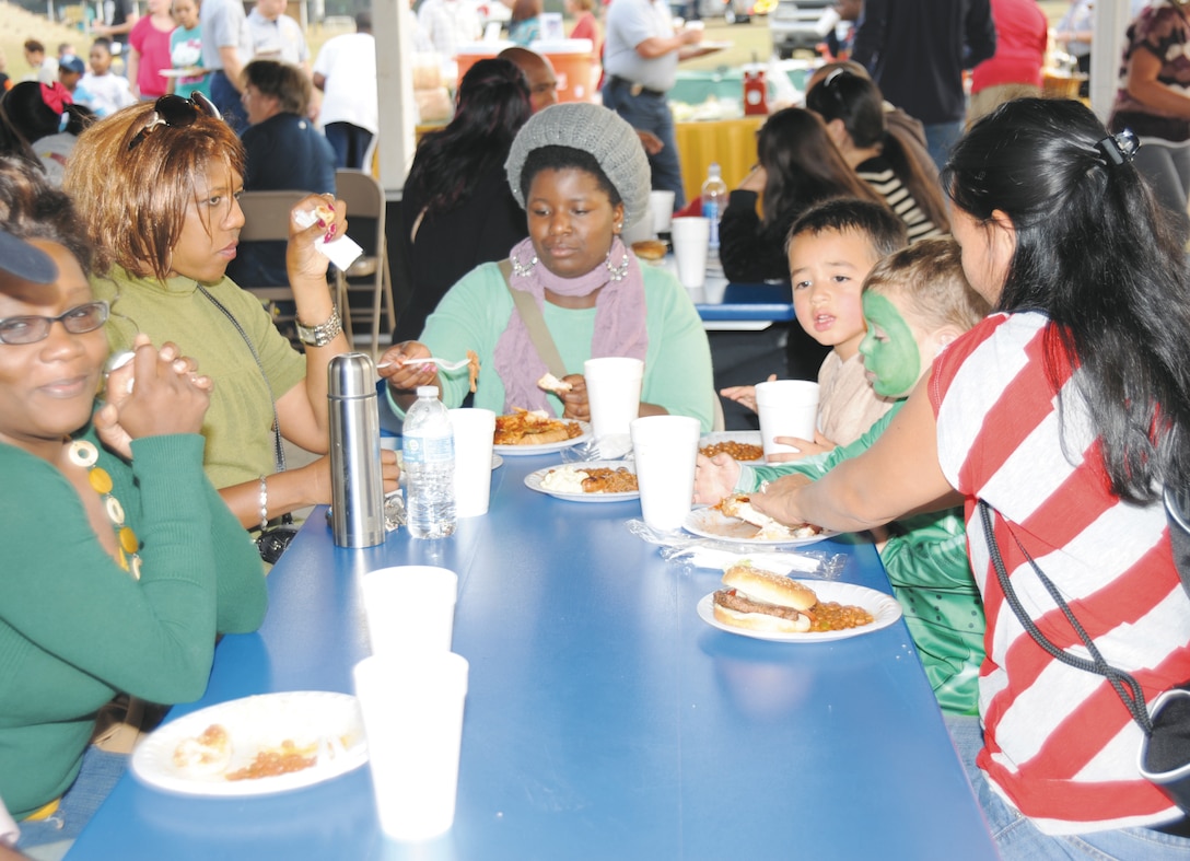 Families feast on barbecue ribs, chicken, pulled pork, hamburgers, hot dogs, baked beans and potato salad, provided by Marine Corps Community Services, during Marine Corps Logistics Base Albany’s second annual Harvest Festival, Oct. 27.