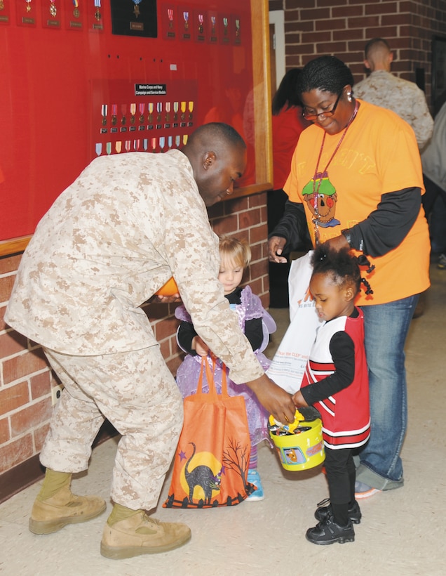 The Child Development Center conducted its annual trick-or-treat parade, here, Tuesday. The children, most of whom were dressed in Halloween costumes, received candy from the various departments as they walked through Building 3500 and in front of Building 3700.