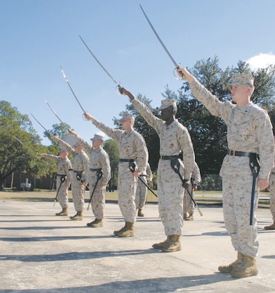 Seventeen Marines, participating in their first professional military education course, the Corporals Course, train many hours practicing basic drill movements and learning the proper use of the NCO sword and guidon for formations and ceremonies.