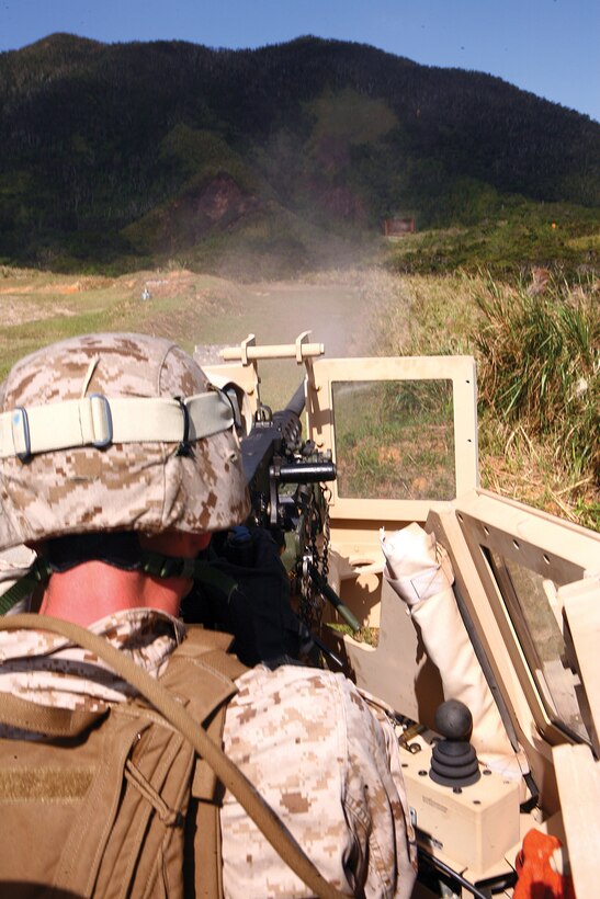 Lance Cpl. Joseph W. Cobb effectively engages a target with a .50-caliber Browning machine gun during crew-served weapons training at Camp Schwab Oct. 24. Cobb is a data systems technician with Combat Logistics Regiment 3, 3rd Marine Logistics Group, III Marine Expeditionary Force. 