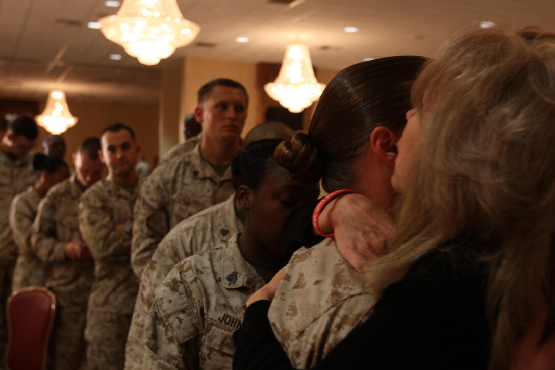 Marines lined up to hug Mrs. Carol Graham who lost both of her sons, one to combat and the other to suicide, during the 10th annual Heroes and Healthy Families conference at the Pacific Views Events Center here Oct. 25.
