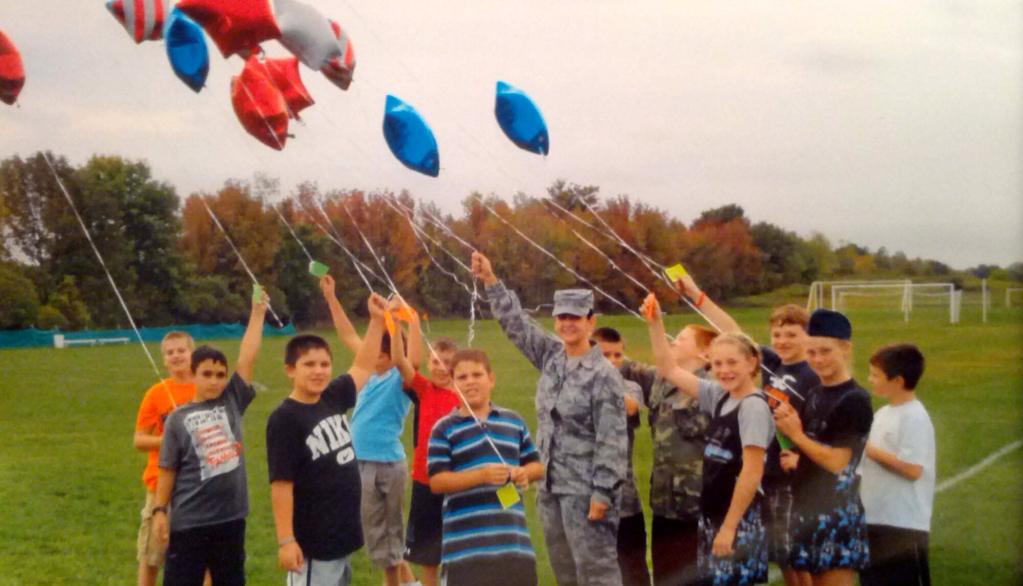 Tech. Sgt. Wendy Curry, a personnel craftsman with the 914th Force Support Squadron, prepares to release balloons with letters addressed to service members serving overseas during Career Day at Palmyra Macedon Middle School, Palmyra, N.Y.  (Courtesy photo)