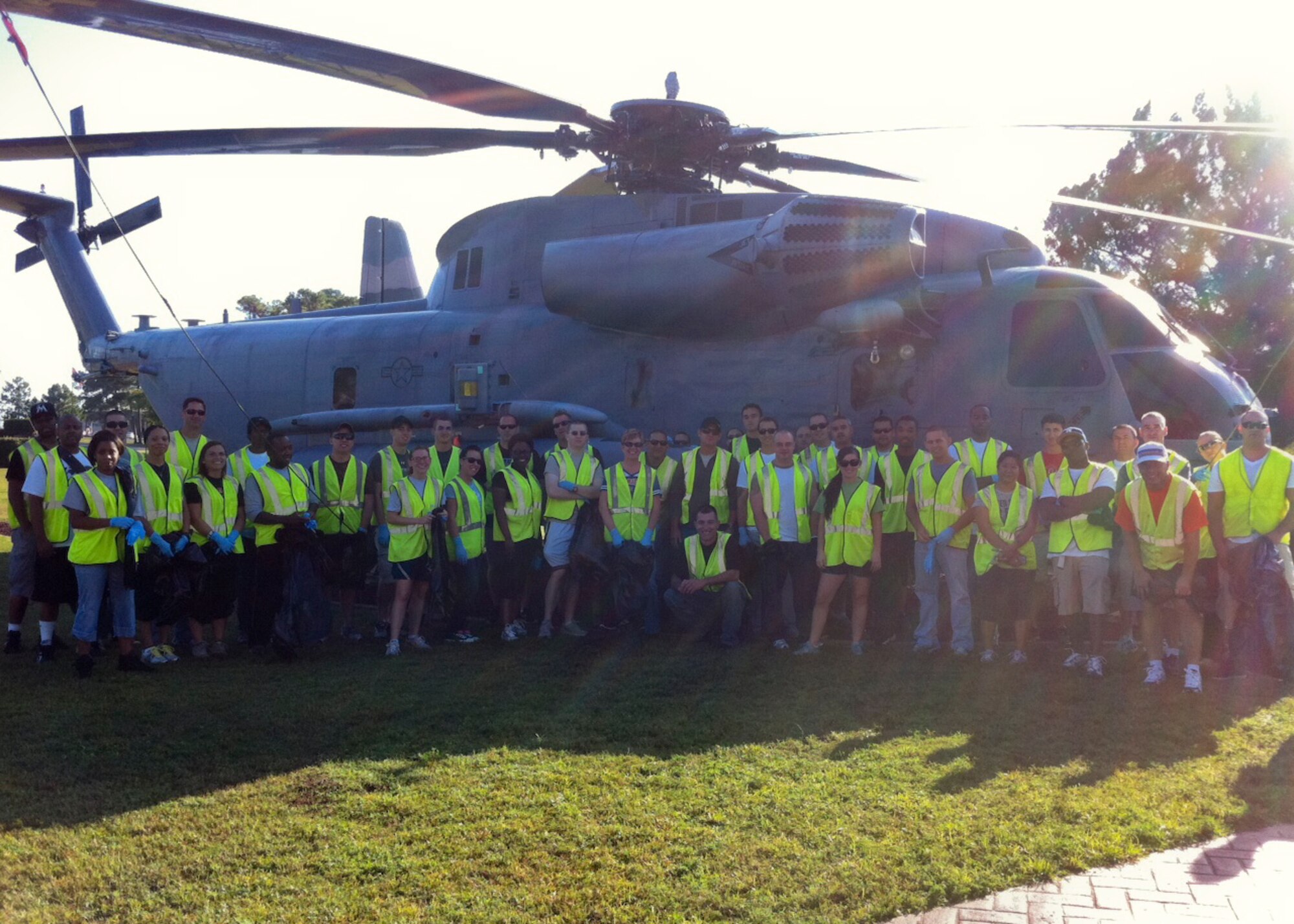 Forty- two Airmen stand in front of a MH-53M Pave Low IV helicopter at Hurlburt Field, Fla., Oct. 26, 2012. Airmen participate in a volunteer effort, sponsored by the Air Force Sergeants Association, to clean a two-mile stretch of road spanning from Hurlburt Field’s front gate to Mary Esther.  (Courtesy photo)