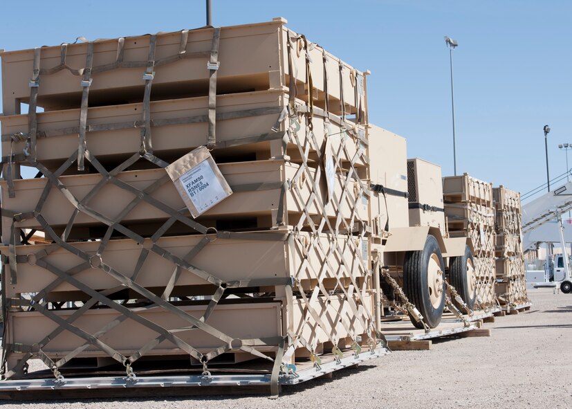 A row of pallets with supplies prepared by the 49th Materiel Maintenance Squadron, sit ready for loading at Holloman Air Force Base, N.M., Nov. 2. The 49th MMS was tasked with supporting the humanitarian relief efforts for the victims of Hurricane Sandy. In response to the tasking, the 49th MMS worked for 15 straight hours preparing more than 58,000 pounds of cargo spread across eight pallets. The cargo consisted of two water pumps capable of pumping 400 gallons of water a minute, 12,000 feet of hose, and two containers of system support items. (U.S. Air Force photo by Senior Airman DeAndre Curtiss/Released)