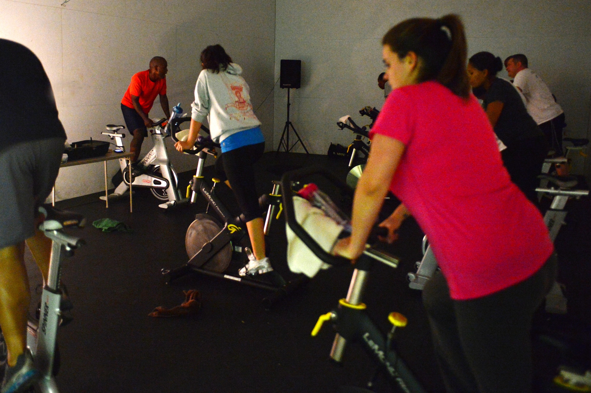 Air commandos participate in a cardio cycling class in the Fitness Center at Cannon Air Force Base, N.M., Oct. 23, 2012. Cardio cycling is one of many classes offered at the Cannon Fitness Center.(U.S. Air Force photo/Airman 1st Class Eboni Reece)