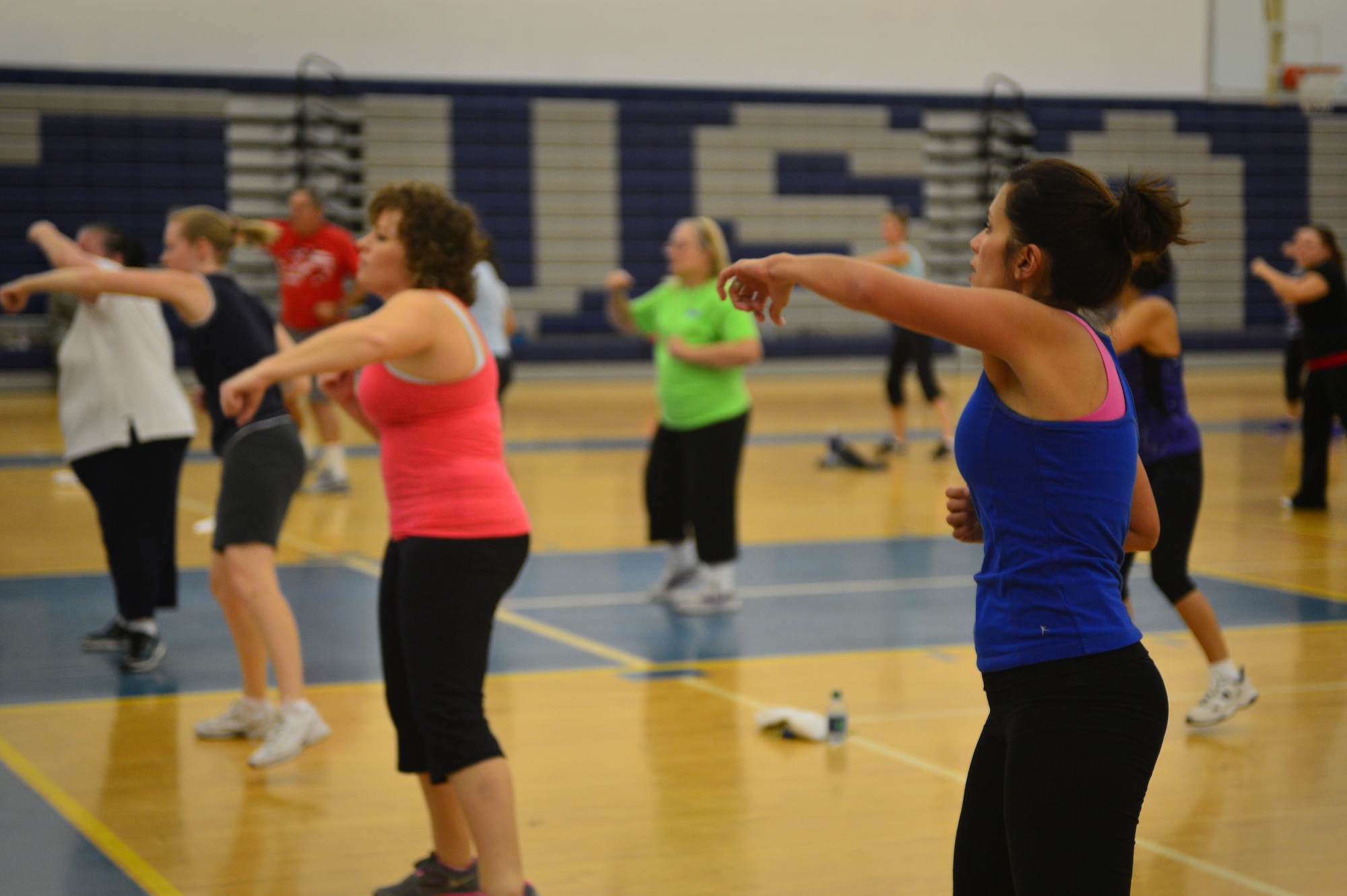 Zumba class participants work out to the rhythm and beats of popular music in the Fitness Center at Cannon Air Force Base, N.M., Oct 23, 2012. The Zumba class is held on Tuesdays and Thursdays at 0900 in the Fitness Center. (U.S. Air Force photo/Airman 1st Class Eboni Reece)