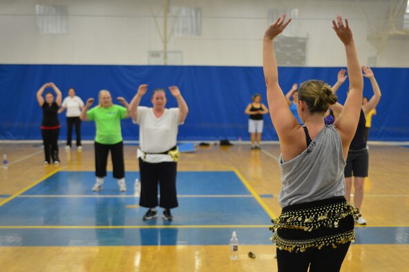 Aaron Lomas, Cannon Fitness center instructor, teaches a Zumba class in the gym at the Cannon Air Force Base, N.M., Oct 23, 2012. Zumba is an hour-long class that meshes several different dance and aerobic exercises performed to popular music. (U.S. Air Force photo/Airman 1st Class Eboni Reece)