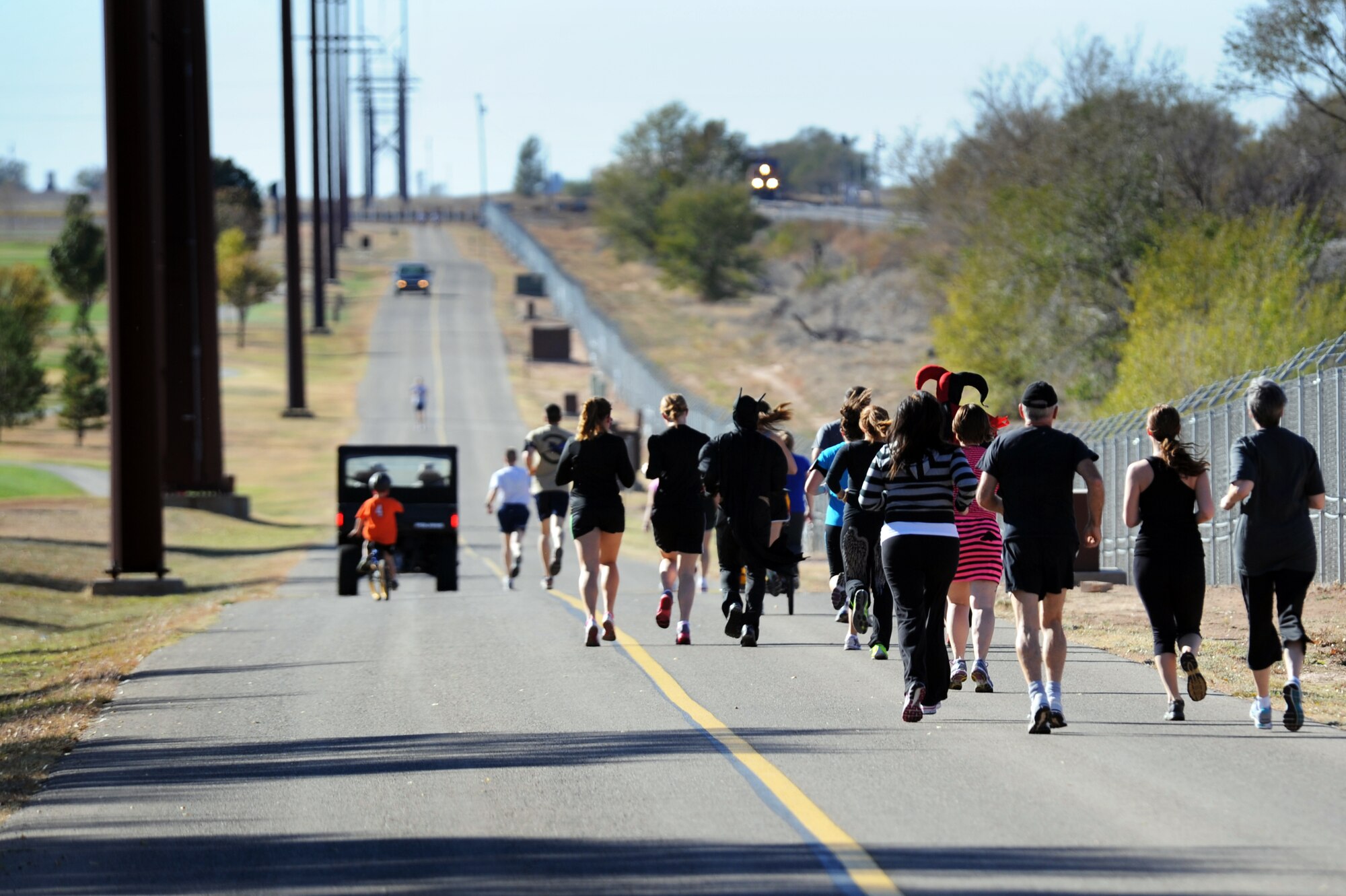 Air Commandos and family members run the course of the Spooky 5K at Cannon Air Force Base, N.M., Oct. 31, 2012.  As a last hurrah to Halloween, the 27th Special Operations Force Support Squadron hosted the fast-paced event. (U.S. Air Force photo/Senior Airman Jette Carr)