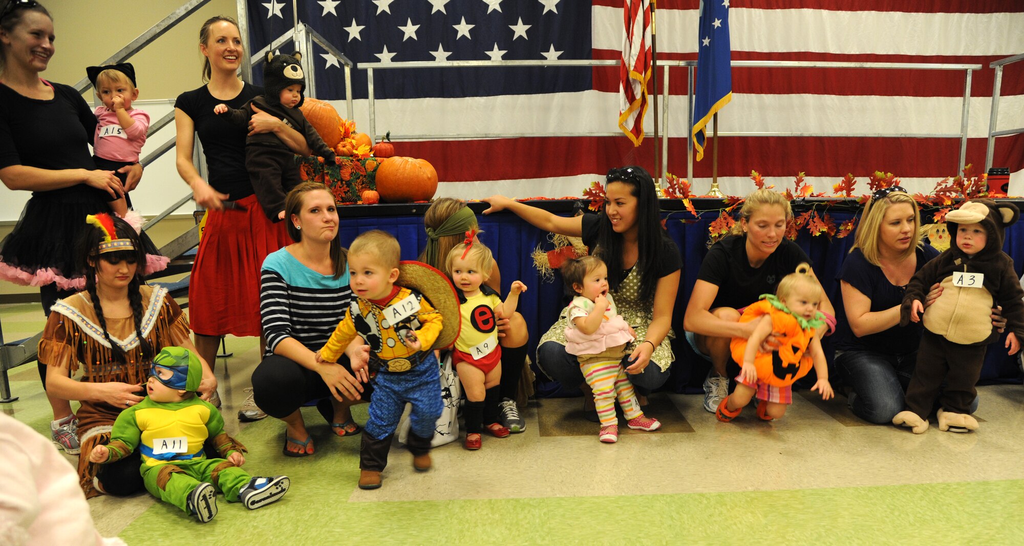 Halloween costume contestants and their support staff line up for judging at the 2012 Fall Fest held Oct 30 in the Armed Forces Reserve Center at Vance Air Force Base, Okla. (U.S. Air Force photo/ Airman 1st Class Frank Casciotta)