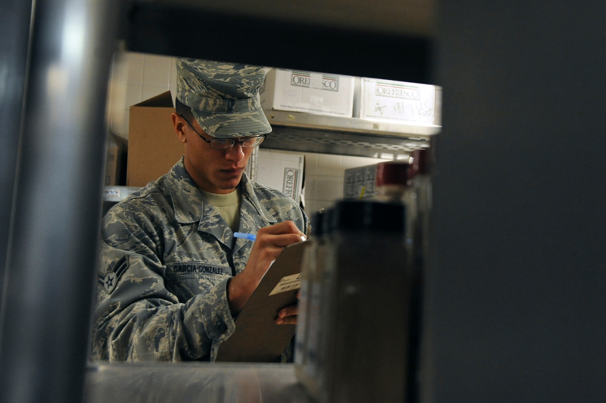 Airman 1st Class Jorge Garcia-Gonzalez, 2nd Force Support Squadron, takes inventory of food supplies in the Red River Dining Facility on Barksdale Air Force Base, La., Oct. 31. At the end of each month, an inventory of all the food is conducted to make sure everything is accounted for. (U.S. Air Force photo/Senior Airman Micaiah Anthony)(RELEASED)