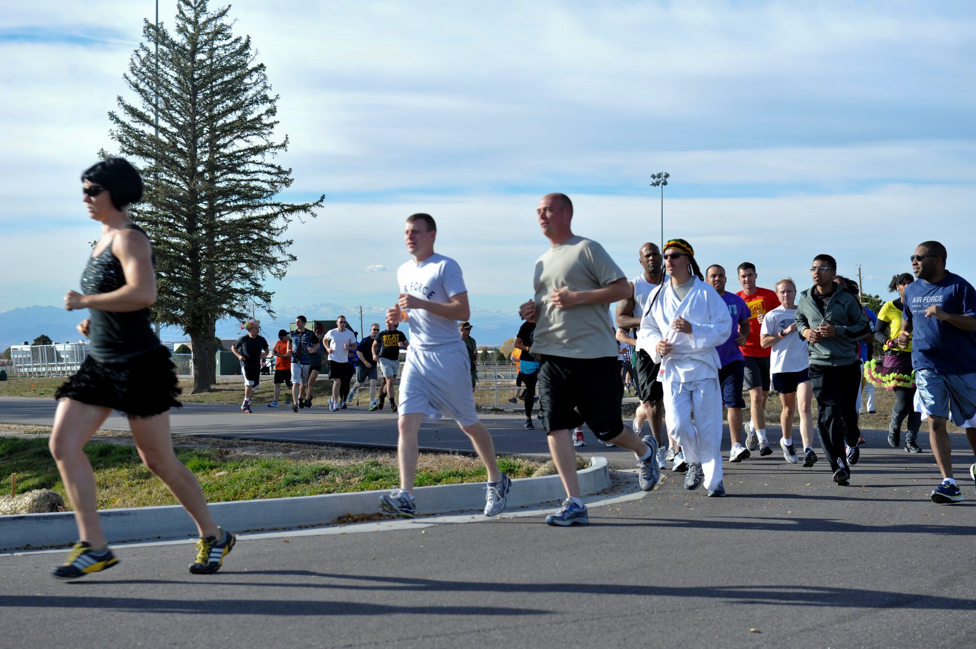 BUCKLEY AIR FORCE BASE, Colo. – Racers begin Buckley's Dreadful Dash 5K Oct. 31, 2012, at the fitness center track. The race concluded at the community center, and people with the best costumes received prizes. (U.S. Air Force photo by Senior Airman Christopher Gross)