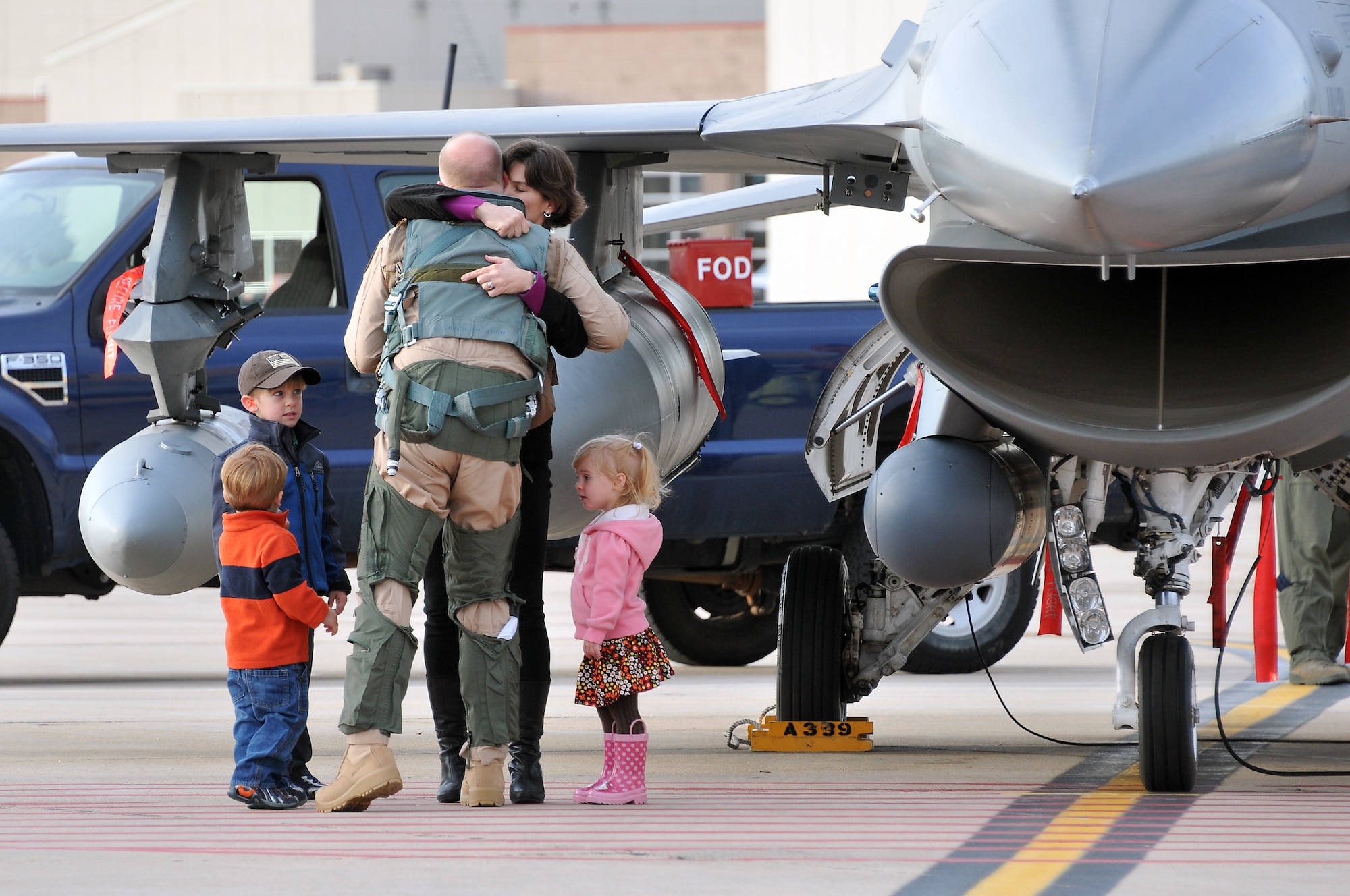 U.S. Air Force Maj. TenEyck “Thor” LaTourrette, 120th Fighter Squadron, gives his wife, U.S. Air Force Lieutenant Col. Tracy LaTourrette a good bye hug along with their three children at Buckley Air Force Base Colo., Nov 1, 2012.  Members of the 140th Wing, Colorado Air National Guard, have been taking off from Buckley AFB, Colo. this week, headed to a forward operating location in support of Air Force Central Command. These pilots, aircraft maintainers and support personnel will be deployed throughout the holiday season in order to support the ongoing Overseas Contingency Operations. (Colorado Air National Guard photo by Tech. Sgt. Wolfram M. Stumpf)