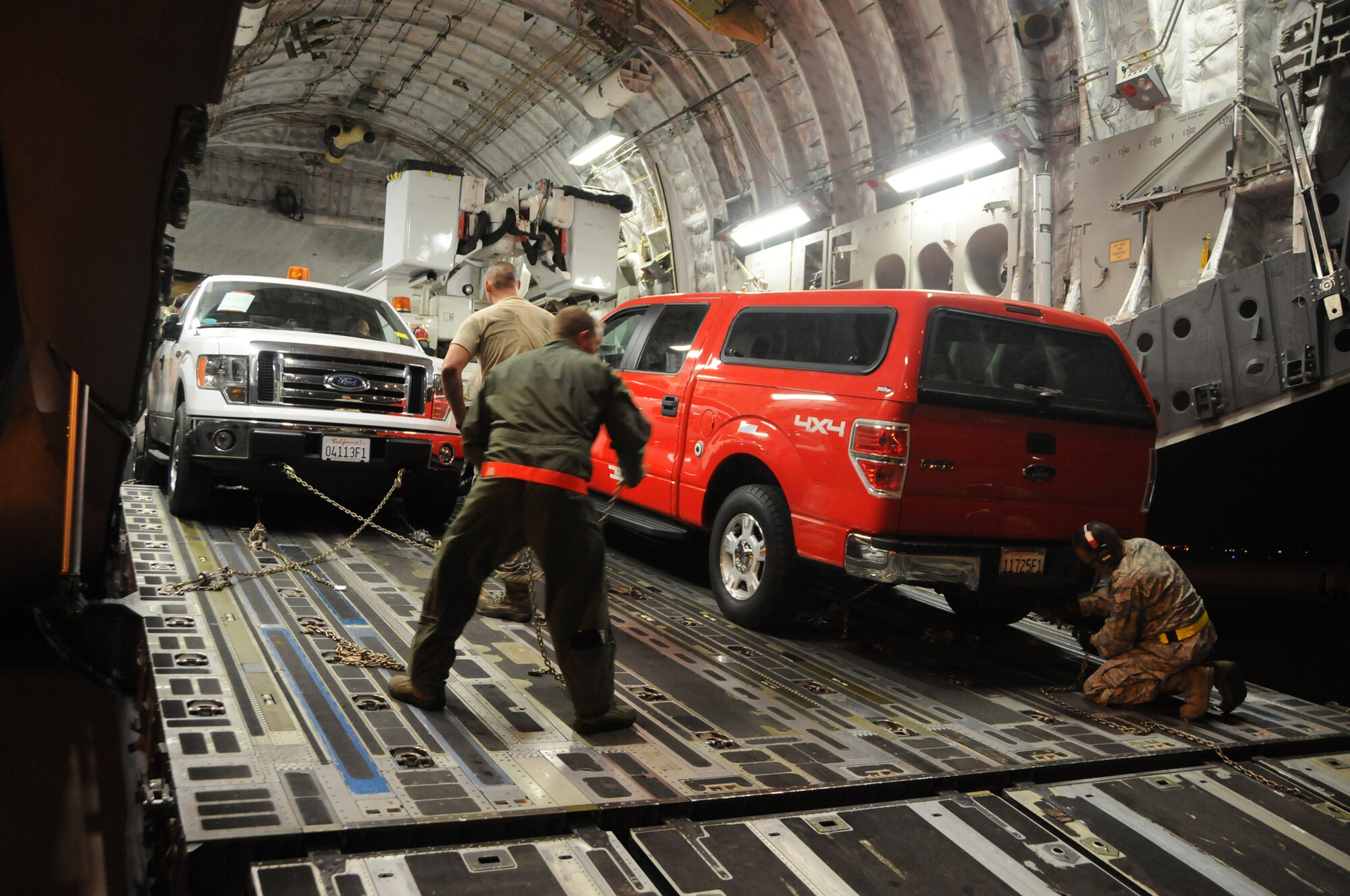 WRIGHT-PATTERSON AIR FORCE BASE, Ohio - The 445th Airlift Wing moved five utility trucks and 26 personnel from the Southern California Edison utility company from March Air Reserve Base, Calif., to Stewart Air National Guard Base, Newburgh, N.Y., Nov. 2 in support of the humanitarian relief efforts to restore power to the areas affected by Hurricane Sandy. (U.S. Air Force photo/Tech. Sgt. Anthony Springer)