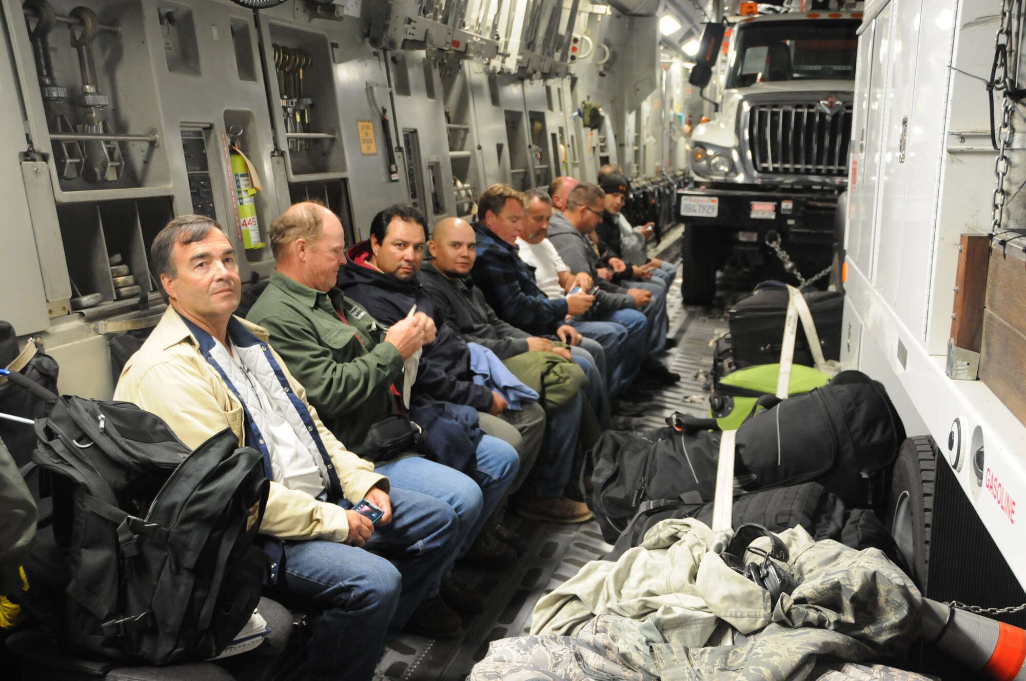 WRIGHT-PATTERSON AIR FORCE BASE, Ohio - The 445th Airlift Wing moved five utility trucks and 26 personnel from the Southern California Edison utility company from March Air Reserve Base, Calif., to Stewart Air National Guard Base, Newburgh, N.Y., Nov. 2 in support of the humanitarian relief efforts to restore power to the areas affected by Hurricane Sandy. (U.S. Air Force photo/Tech. Sgt. Anthony Springer)