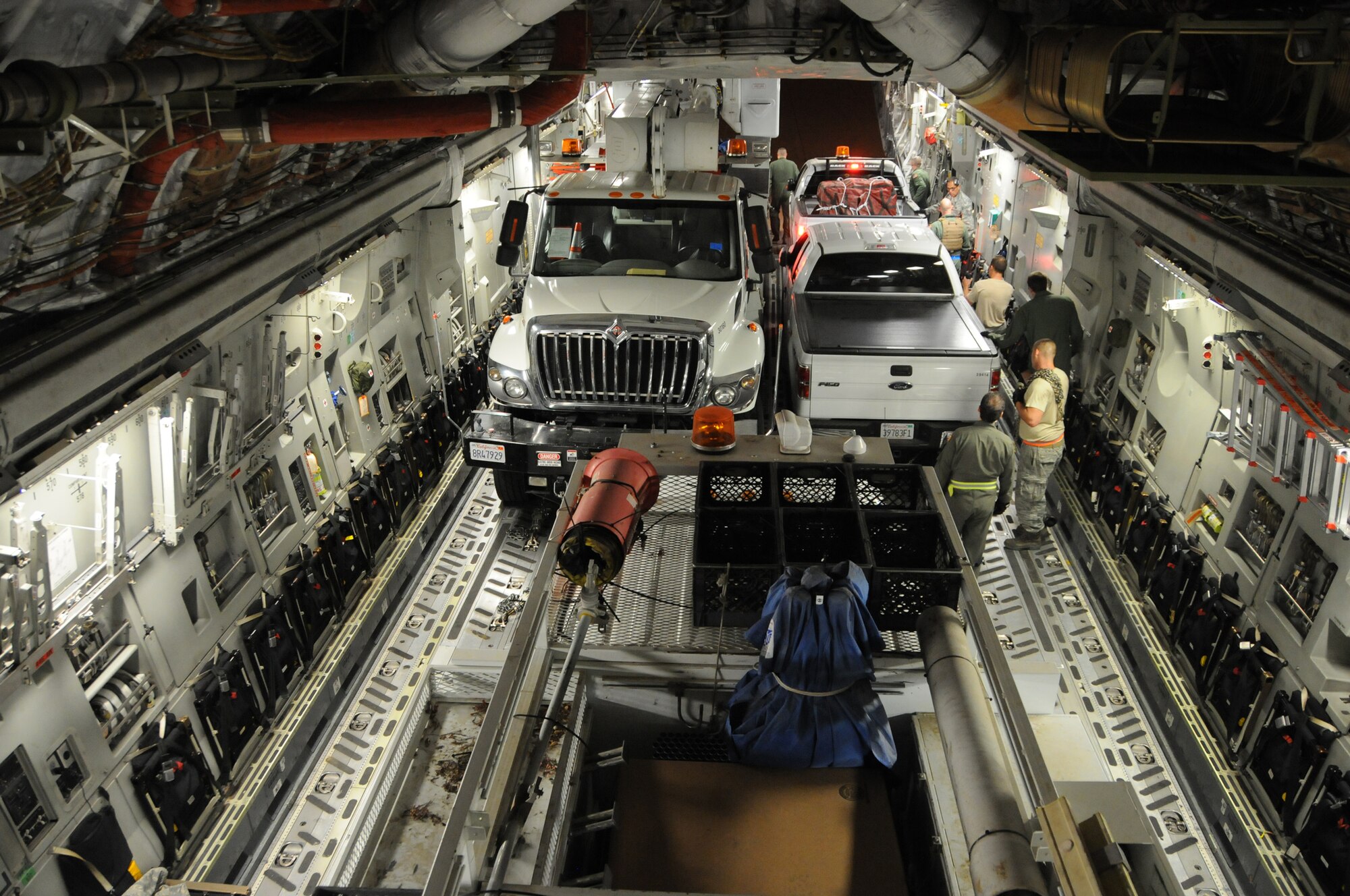 WRIGHT-PATTERSON AIR FORCE BASE, Ohio - The 445th Airlift Wing moved five utility trucks and 26 personnel from the Southern California Edison utility company from March Air Reserve Base, Calif., to Stewart Air National Guard Base, Newburgh, N.Y., Nov. 2 in support of the humanitarian relief efforts to restore power to the areas affected by Hurricane Sandy. (U.S. Air Force photo/Tech. Sgt. Anthony Springer)