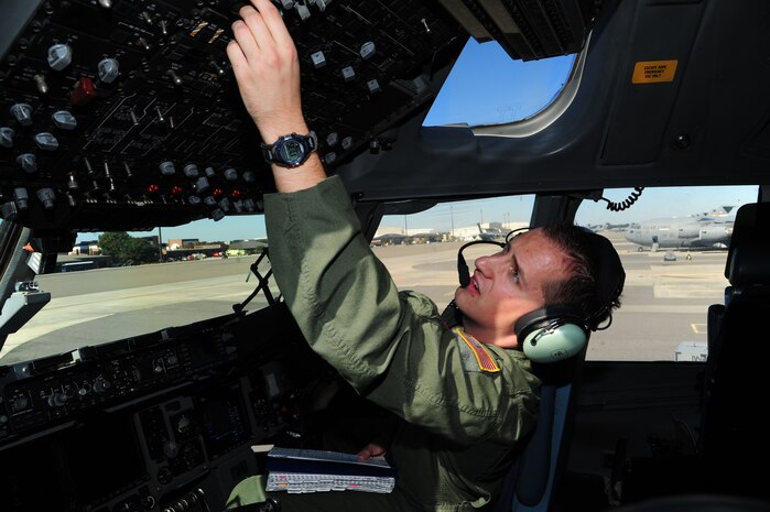 1st Lt. Jonathon Lewcyzyk, 16th Airlift Squadron co-pilot, conducts pre-flight checks on the flight deck of C-17 Globemaster III before takeoff to March Reserve Air Force Base, Calif.,  Nov. 1, 2012, at Joint Base Charleston – Air Base, S.C. The air crew was dispatched to pick up supplies and cadaver teams and deliver them to assist with the relief efforts for Hurricane Sandy affecting the Northeast. (U.S. Air Force photo /Staff Sgt. Rasheen Douglas)