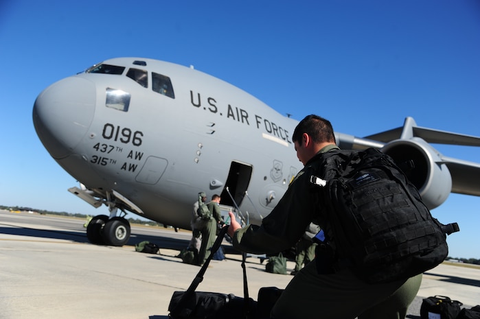 Airman 1st Class Dwayne Baldwin, 16th Airlift Squadron loadmaster, prepares to load equipment and bags onto a C-17 Globemaster III before takeoff Nov. 1, 2012, at Joint Base Charleston – Air Base, S.C. The aircrew was tasked to fly to March Reserve Air Force Base, Calif., to pick up supplies and cadaver teams and deliver them to assist with the relief efforts for Hurricane Sandy affecting the Northeast. (U.S. Air Force photo /Staff Sgt. Rasheen Douglas)