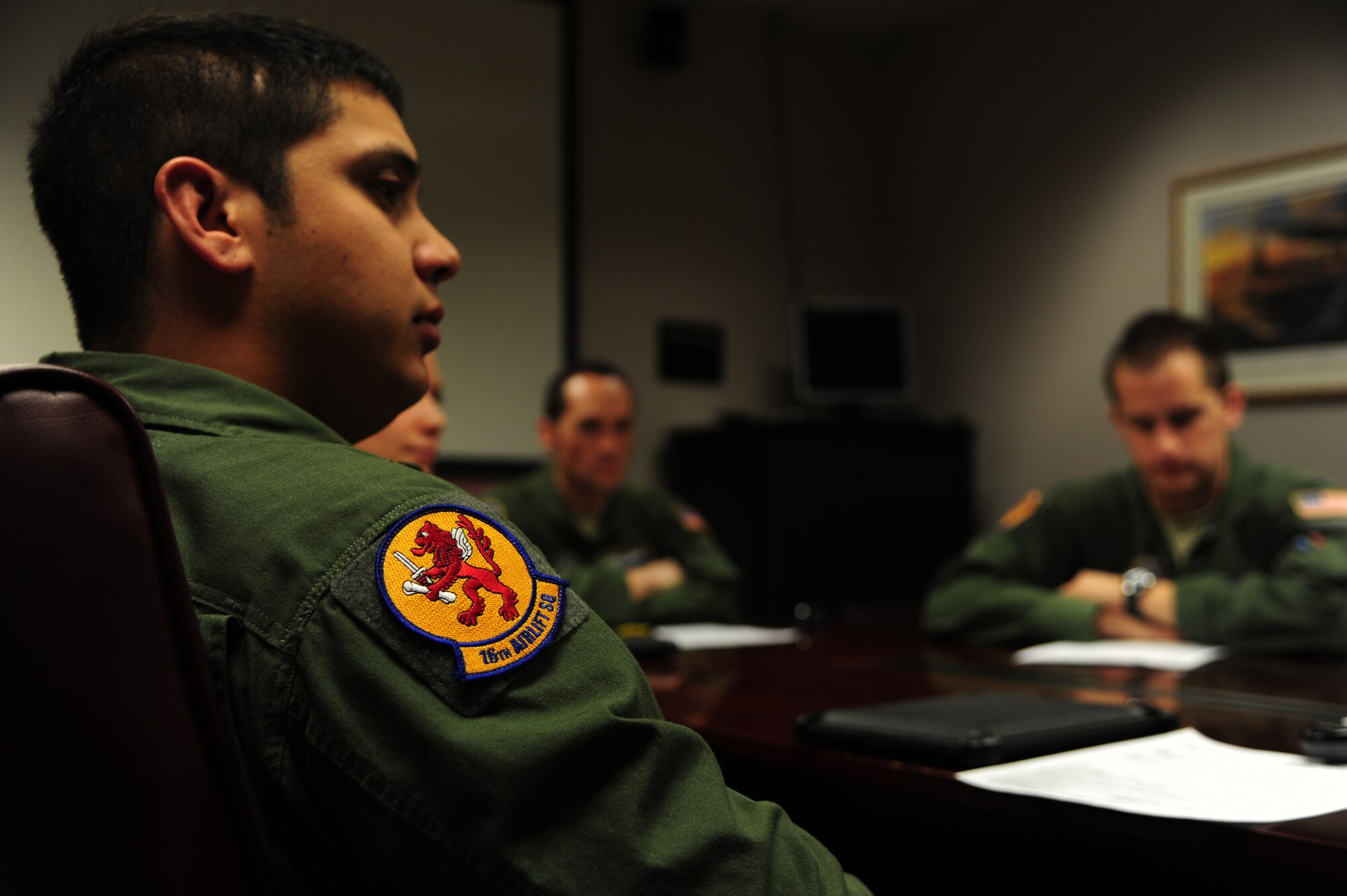 Airman 1st Class Dwayne Baldwin, 16th Airlift Squadron loadmaster, listens to a mission brief before takeoff Nov. 1, 2012, at Joint Base Charleston – Air Base, S.C. The aircrew was tasked to fly to March Reserve Air Force Base, Calif., to pick up supplies and cadaver teams and deliver them to assist with the relief efforts for Hurricane Sandy affecting the Northeast. (U.S. Air Force photo /Staff Sgt. Rasheen Douglas)